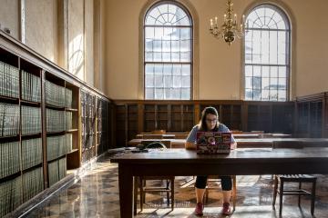 student studying in library