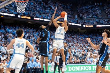 UNC men's basketball game versus Duke. UNC player takes a shot.