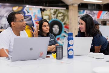 Carolina students interact at a coding event in the UNC Library