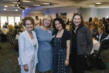 Dr. Janet Guthmiller stands next to Leslie Nelson-Bernier, Susin Seow and Jen Bowman from the University Development Office