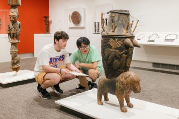 Students observe art at the Ackland Art Museum.