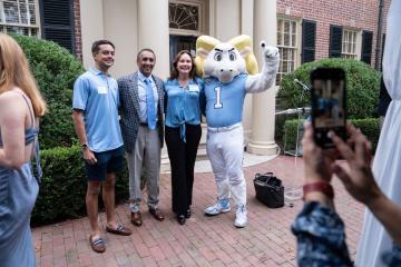Members of the Carolina Parents Leadership Society gather with their families at the Carolina Inn