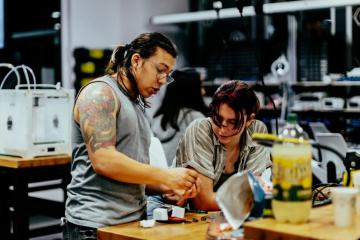 Two students work together in the BeAM Makerspace.