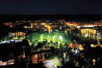 Aerial view of UNC-Chapel Hill campus at night.
