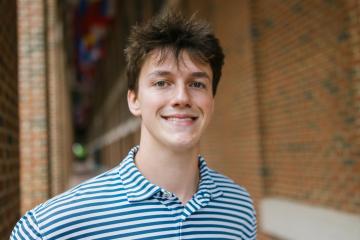 Anthony Coble poses for a portrait photo outside the Kenan-Flagler Business School.