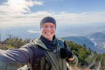 Jakob Wiedekind takes a selfie with the North Carolina mountains in the background