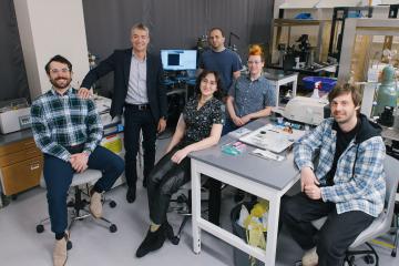 Greg Scherrer and five members of his lab pose in his lab
