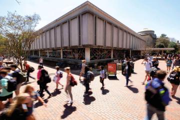Students walk by the House Undergraduate Library on the UNC campus