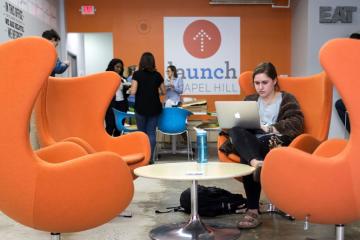 Student sitting in Launch lounge