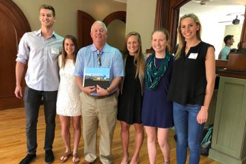 Ricky May, third from left, with previous Carolina Blue Honors Fellows.