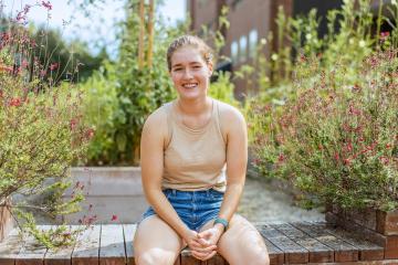 Lydia Rowen sits in garden
