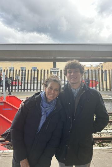 Mom and son in front of Oxford train station.