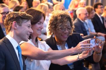 Chancellor Lee H. Roberts taking a selfie with attendees at an event welcoming him as Carolina's 13th chancellor on Aug. 9, 2024, at Kenan Center. (Jon Gardiner/UNC-Chapel Hill)