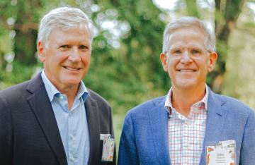 UNC alumni Heath Massey (BA &rsquo;83), left, and John Mitchener (BSBA &rsquo;81).
