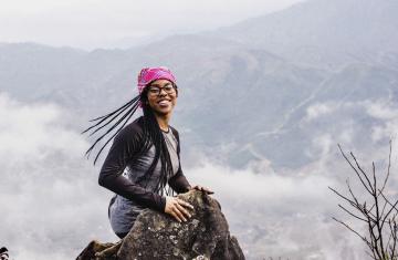Taylor Doggett smiles perched at the top of the Sa Pa mountains in Northern Vietnam.