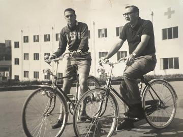 Larry Brown riding bikes with assistant coach Hank Vaughn.