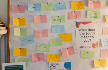Board with post-it note responses to question "What does the South mean to you?"