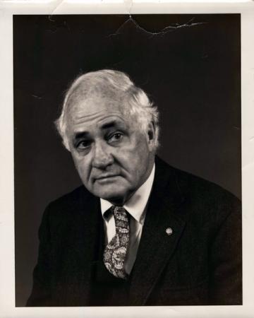 Black and white portrait photo of Sherman Lee.