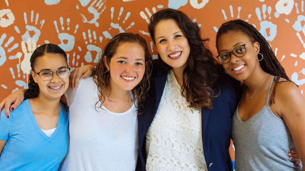 4 women pose for a photo at a Carolina Latinx Center event