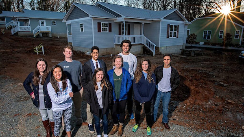 Community Service Scholarship recipients volunteering at the construction of a house