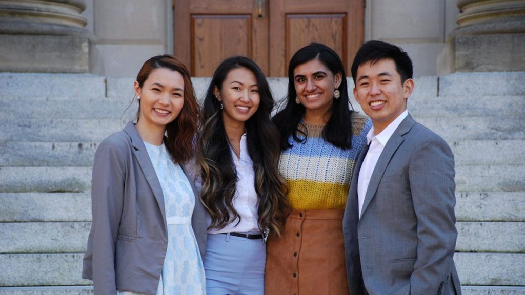 4 students pose for a photo at an Asian American Center event
