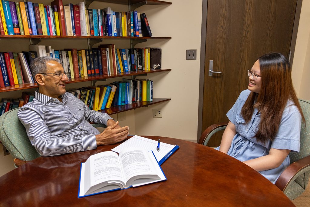 Distinguished Alumni Professor Joseph Ibrahim meeting with a student in his office